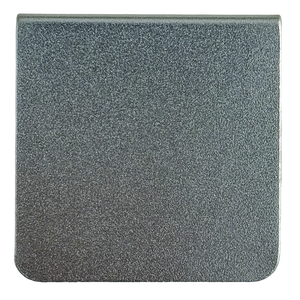 The image is a square-shaped surface with a textured, metallic appearance, possibly made of a material like metal or a textured fabric.
