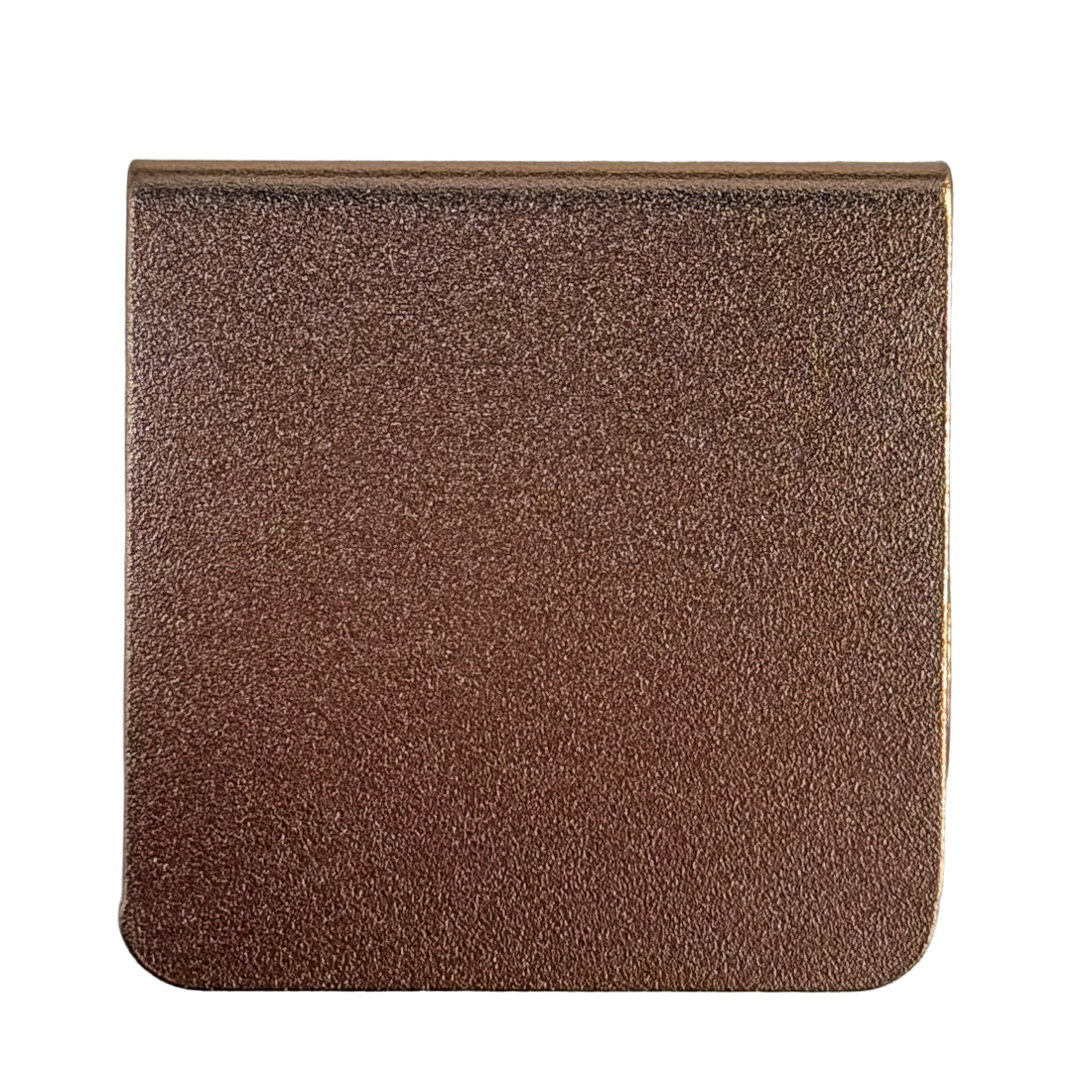 a square-shaped object with a textured surface, possibly made of a material with a metallic or bronze-like appearance.