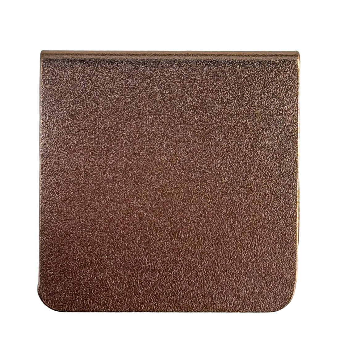 a square-shaped object with a textured surface, possibly made of a material with a metallic or bronze-like appearance.