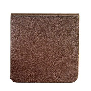 a square-shaped object with a textured surface, possibly made of a material with a metallic or bronze-like appearance.
