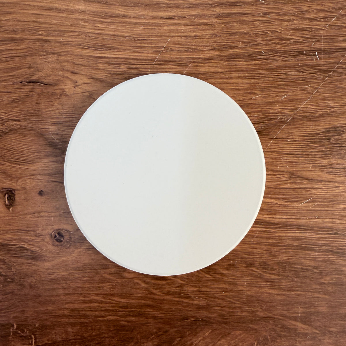 Round ceramic coaster blank for UV printing, bright white, 10 cm across with cork backing