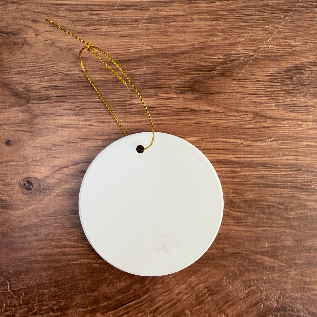 Bright white ceramic ornament blank for UV printing, 3 in round, shown with the gold hanging string
