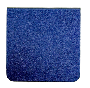 The image is a close-up of a solid blue surface, possibly a piece of fabric or a tile.